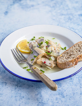Marrinated herring in onion and herbs