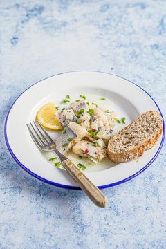 Marrinated herring in onion and herbs