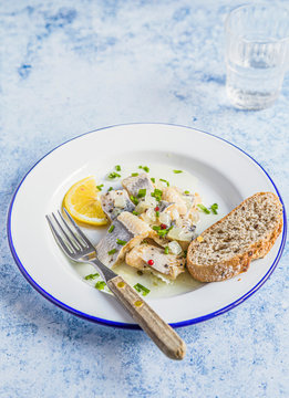 Marrinated herring in onion and herbs