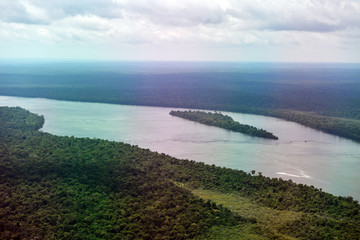 large river in the wild jungle and nature park from a helicopter