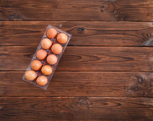 Fresh egg on wooden table background