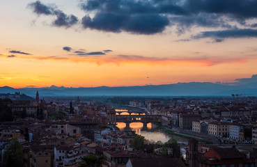 Amazing panoramic night view of Florence city, Italy with the river Arno and Ponte Vecchio.