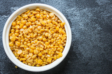 dry yellow peas boiled porridge healthy food (meat product sausage) menu concept background. top view. copy space for text