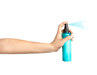 In hand bottle of hair spray isolated on white background