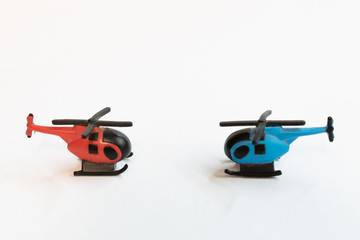 Small colorful helicopter toys isolated on a white background - air travel by helicopter concept