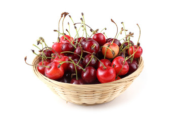 Cherries on wicker plate