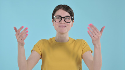 The Young Woman Calling towards Herself with Hand Gesture on Purple Background