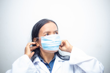 Elderly asian women wearing KN95 masks covering their mouths and noses preventing coronavirus and pm 2.5 dust on white background.