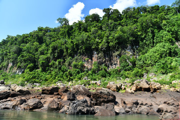 Fototapeta na wymiar a trip to the roaring waterfalls on the river in a motor boat in a national park in brazil