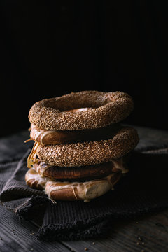 German Bread Pretzel and Bagel Breakfast on a wooden table. Black Background.
