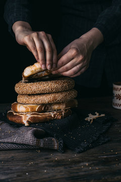 German Bread Pretzel and Bagel Breakfast on a wooden table. Black Background.