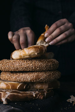 German Bread Pretzel and Bagel Breakfast on a wooden table. Black Background.