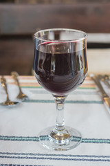 Glass of homemade dry red wine