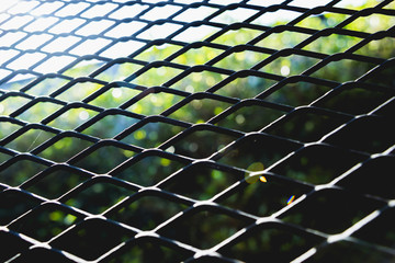 Fototapeta premium Abstract metal grid background. Lattice texture with big cells grid.