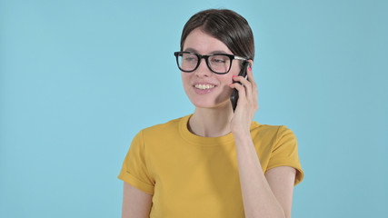 The Happy Young Woman Speaking on Phone on Purple Background