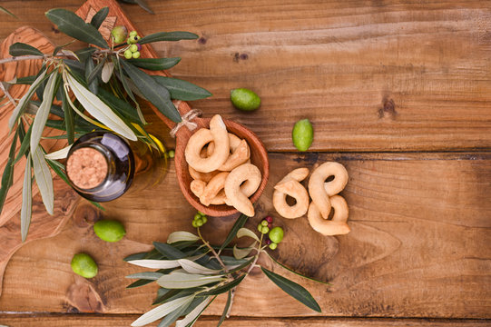 Italian wine appetizer Tarall on a wooden table.i. Traditional salted biscotti south of Italy. Above. Copy space