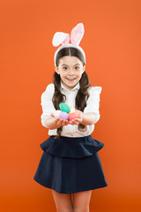Dyed eggs for Easter celebration. Fun and educational Easter holiday activities for kids of all ages. Adorable little girl with easter eggs. Cute bunny schoolgirl celebrate Easter day. Spring holiday