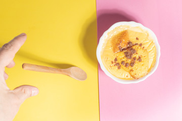 delicious custard in yellow and pink background