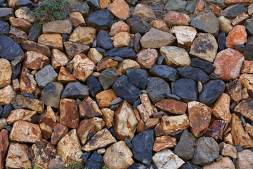 Texture of a yellow granite stone wall for background