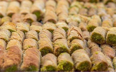 Baklawa (baklawa) traditional and authentic Middle Eastern Arabian pastry, fried dough wires, honey, in the shape of an open square. Stuffed with pistachios. Mahane Yehuda Market, Jerusalem.