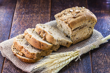 homemade vegan bread with nuts, chestnuts, oats and flaxseed. Healthy life and diet concept.