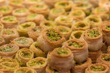 Baklawa (baklawa) traditional and authentic Middle Eastern Arabian pastry, fried dough wires, honey, in the shape of an open square. Stuffed with pistachios. Mahane Yehuda Market, Jerusalem.