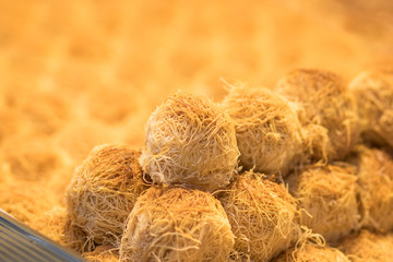 Baklawa (baklawa) Traditional and authentic Middle Eastern Arabian pastry, fried dough, honey, ball shaped. Stuffed with almond pistachios and ground nuts. Mahane Yehuda Market, Jerusalem.