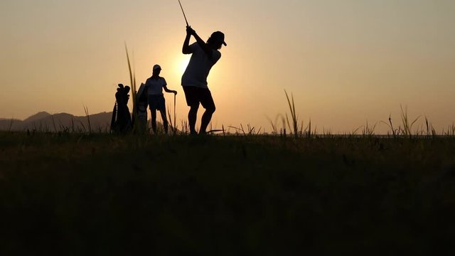 couple lover playing golf together in the course, try to keep golf ball away from the rough to fairway, difficult time stay together in the family concept