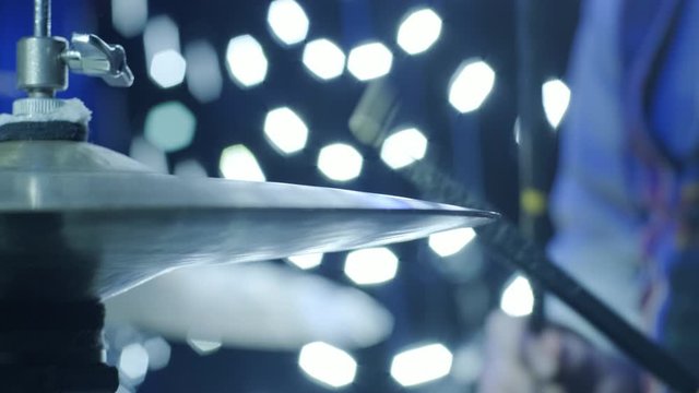Rock drummer plays music on concert. Close up.