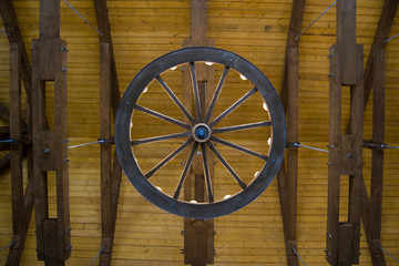 chandelier in an old building made of a wheel from a carriage