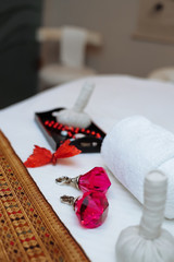 table with massage accessories and crystal and butterfly decorations