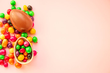 chocolate egg and candy easter decor, menu concept background. top view. copy space for text