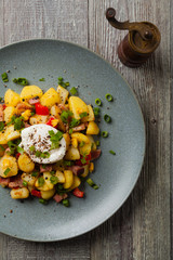 Traditional American hash with fried eggs. Top view.