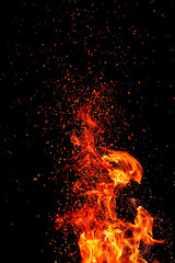Fototapeta na wymiar Flame, sparks on a black background. Bokeh effect.