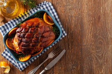 Whole baked ham. Cut thick skin. Marinated in oranges and honey. Top view.
