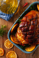 Whole baked ham. Cut thick skin. Marinated in oranges and honey. Top view.