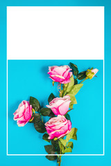 Pink roses on a blue background with the decorative graphics