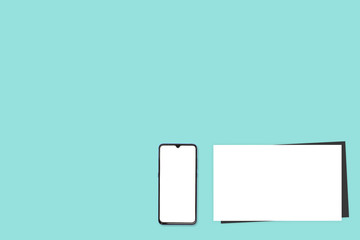 Phone and coffee on a blue background. Technology concept background. White screen phone copy space. Concept photos of desks / commercial backgrounds. Billboard background.