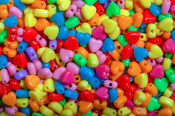 Macro photography of some colorful beads of different shape used for manufacturing jewerly and accesories.