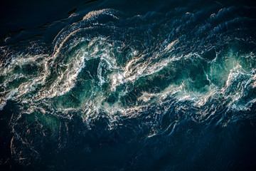 Waves of water of the river and the sea meet each other during high tide and low tide