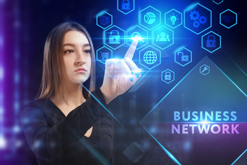 Business, Technology, Internet and network concept. Young businessman working on a virtual screen of the future and sees the inscription: Business network