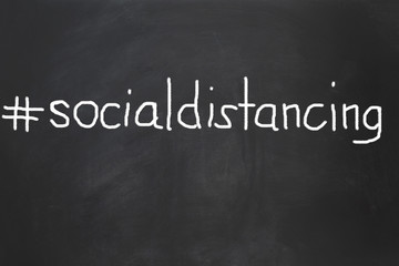 Obraz premium social distancing to control infection during virus epidemic - chalk on blackboard