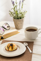 Still life with coffee, cake and a bouquet of lavender