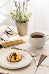 Still life with coffee, cake and a bouquet of lavender