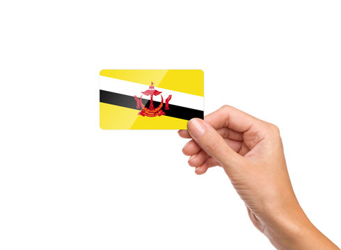 Beautiful Hand Holding Brunei Flag Card On White Background