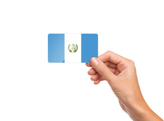 Beautiful hand holding Guatemala flag card on white background