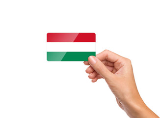 Beautiful hand holding Hungary flag card on white background