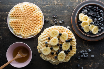 Waffles with various fruits and maple syrup