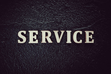 Word service written on black background