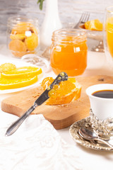 Orange jam with white bread on the table
